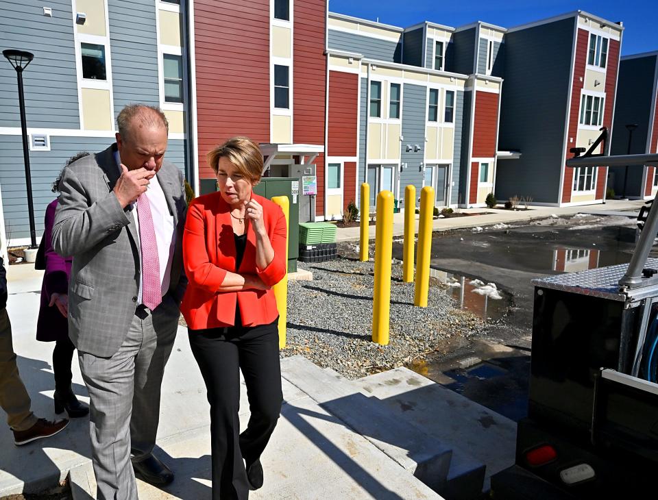 Gov. Maura Healey talks with Worcester Mayor Joseph Petty as she tours Grand Street Commons.