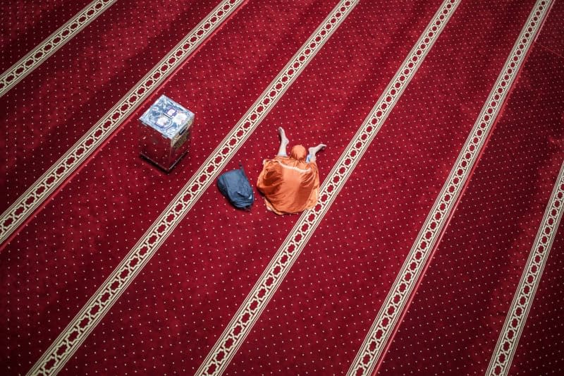 A woman rests at the at Istiqlal Mosque in Jakarta, during the Muslim's holy fasting month of Ramadan. Ramadan is the ninth and holiest month of the Islamic calendar, during which Muslims from all over the world refrain from eating, drinking and smoking from dawn to dusk. Donal Husni/ZUMA Press Wire/dpa