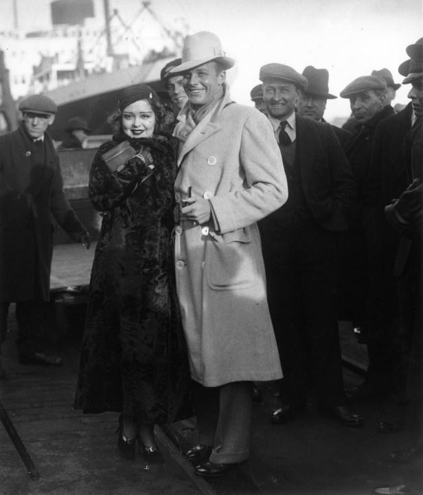 21st December 1932: American actress Clara Bow (1905 – 1965) and her husband, actor Rex Bell (1903 – 1962) arrive in Southampton from America. (Photo by Keystone/Getty Images)