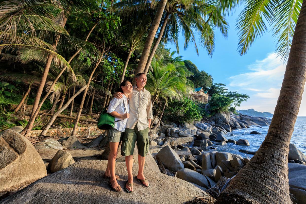 senior couple at romantic tropical beach in Thailand