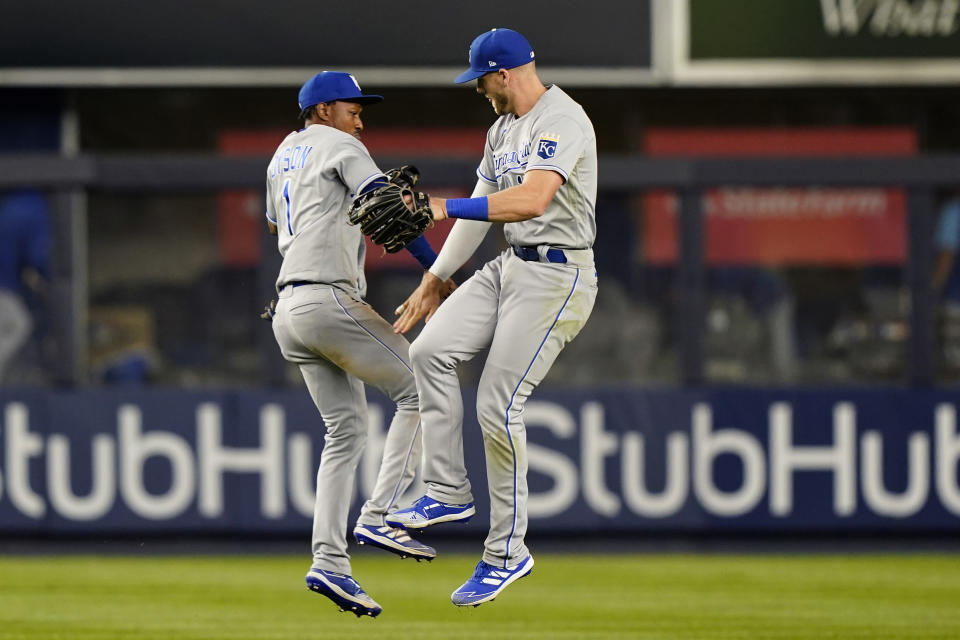 Kansas City Royals outfielders Jarrod Dyson (1) and Hunter Dozier (17) celebrate after the Royals 6-5 win over the New York Yankees in a baseball game, Tuesday, June 22, 2021, at Yankee Stadium in New York. The Royals defeated the Yankees 6-5. (AP Photo/Kathy Willens)