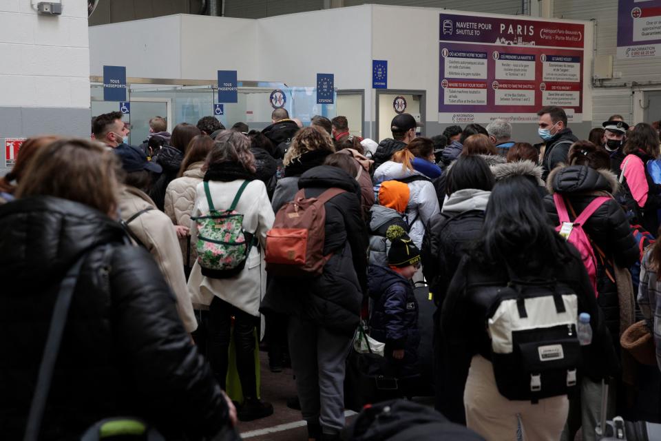 Ukrainian nationals fleeing the conflict in their country queue to pass through border control upon arrival at the Paris-Beauvais Airport in Tille, north of Paris, on March 2, 2022, seven days after Russia launched a military invasion of Ukraine. - The number of refugees fleeing the conflict in Ukraine has surged to nearly 875,000, UN figures showed on on March 2, as fighting intensified on day seven of Russia's invasion. (Photo by GEOFFROY VAN DER HASSELT / AFP) (Photo by GEOFFROY VAN DER HASSELT/AFP via Getty Images)