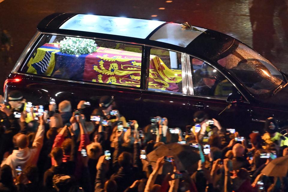 Seen from the top of the Wellington Arch, the coffin of Queen Elizabeth II is taken in a royal hearse to Buckingham Palace in London to lie at rest overnight in the Bow Room on September 13, 2022.