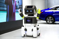 Various press images of the Hyundai DAL-e customer service robot.