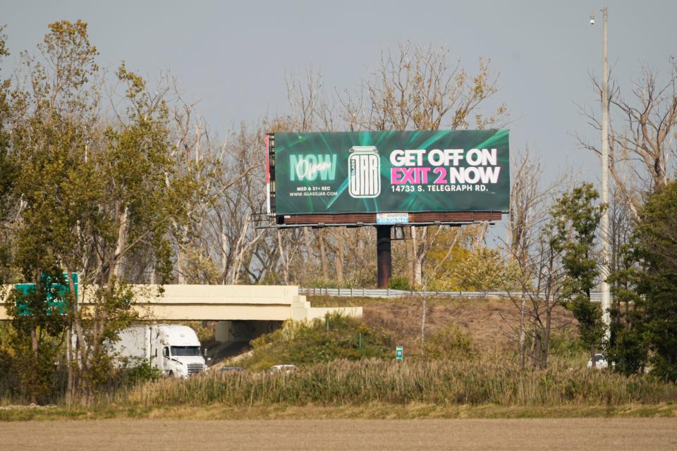 Billboards attract drivers to Glass Jar Cannabis, now known as NAR, along I-75, just north of the Ohio border.