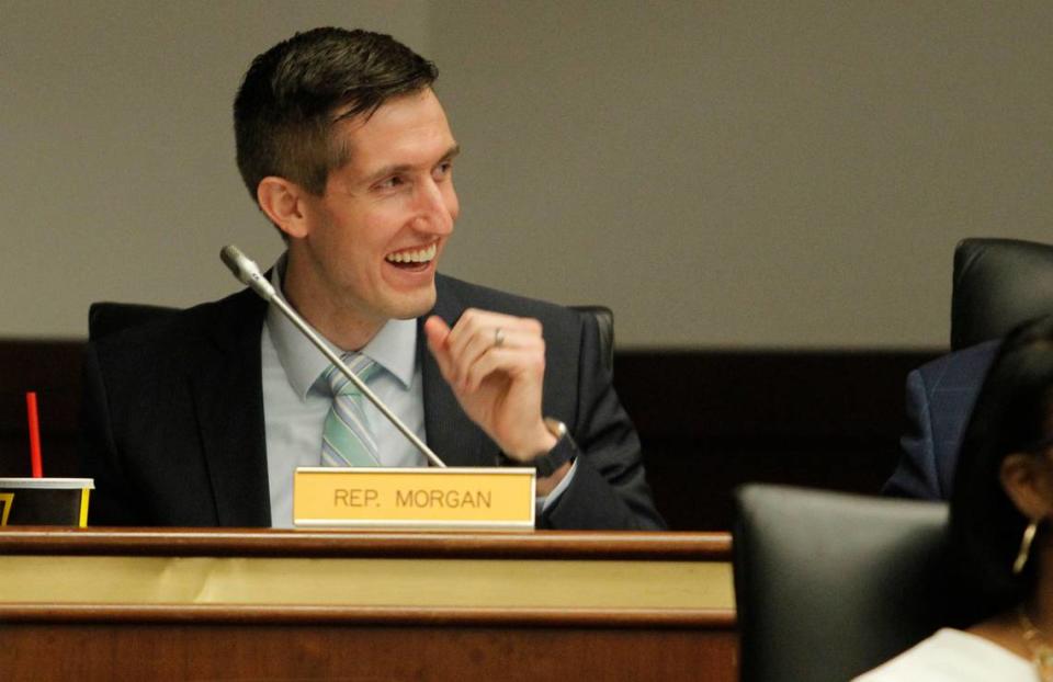 State Rep. Adam Morgan shares a laugh with other members before the start of the Education and Public Works Full Committee meeting in Columbia, S.C. on Tuesday, March 1, 2022. (Travis Bell/STATEHOUSE CAROLINA)