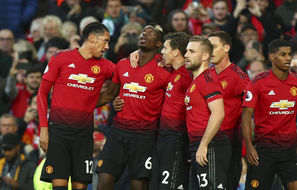 Manchester United's Paul Pogba, 2nd left, celebrates after scoring the opening goal during the English Premier League soccer match between Manchester United and Everton FC at Old Trafford in Manchester, England, Sunday Oct. 28, 2018. (AP Photo/Dave Thompson)