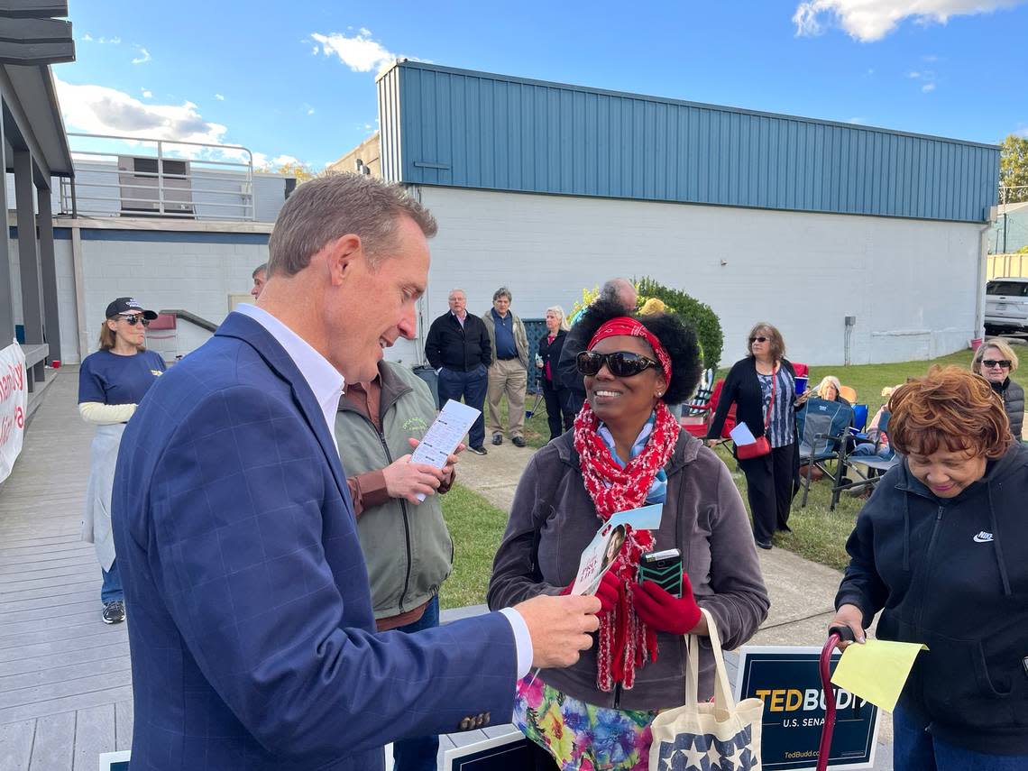 Republican U.S. Senate candidate Ted Budd talks to a voter during a campaign event in Durham County on Tuesday, Oct. 18, 2022.