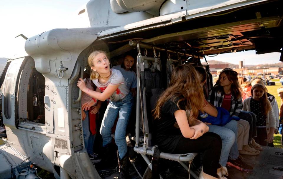Fourth grader Laelah Shirk and her classmates check out the VX-1 Pioneers MH-60S helicopters that were flown in to the Bald Eagle Area Veterans Day celebration on Thursday, Nov. 9, 2023. Abby Drey/adrey@centredaily.com