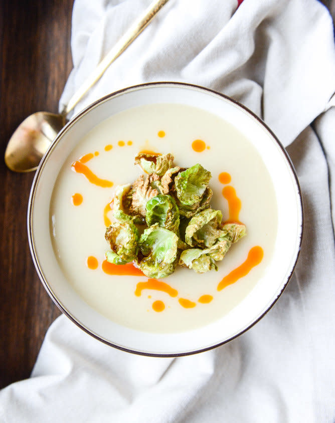 <strong>Get the <a href="https://www.howsweeteats.com/2015/01/creamy-roasted-garlic-potato-soup-with-crispy-brussels-chili-oil/" target="_blank">Creamy Roasted Garlic Potato Soup with Crispy Brussels and Chili Oil recipe</a>&nbsp;from How Sweet Eats</strong>