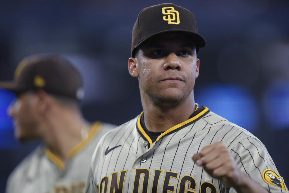 San Diego Padres left fielder Juan Soto offers a fist bump to a teammate after the eighth inning of the team's baseball game against the Toronto Blue Jays on Tuesday, July 18, 2023, in Toronto. (Chris Young/The Canadian Press via AP)