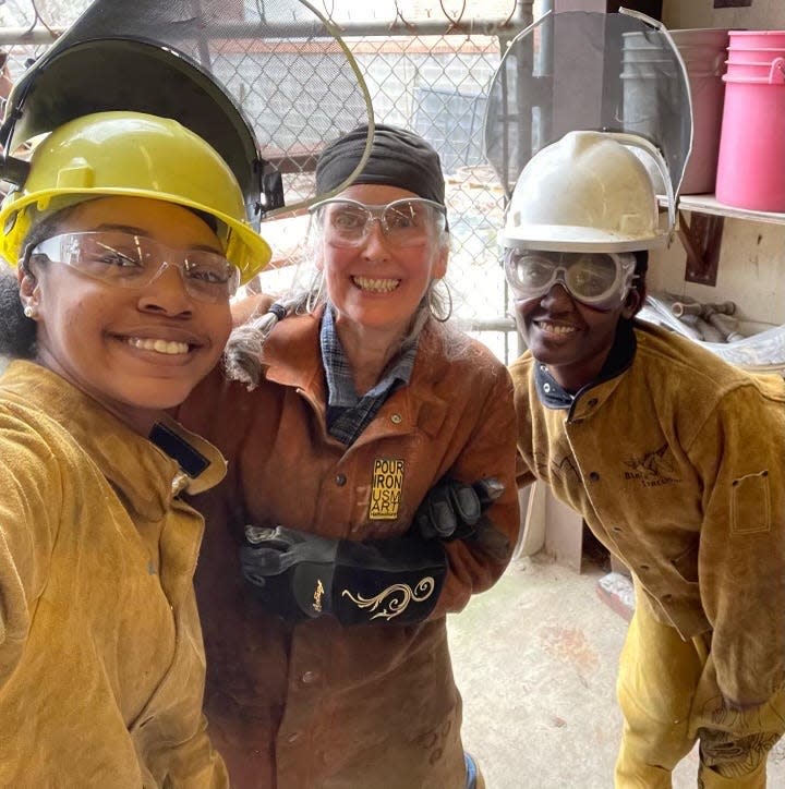 University of Southern Mississippi professor Jennifer Torres poses for a photo with students Dee and Desirae. Some of Torres' students will show their work in an exhibit in Waveland, Miss., alongside noted Harlem Renaissance sculptor Richmond Barthé, a Bay St. Louis native.