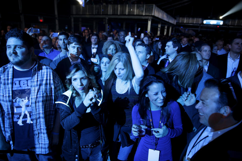 This Jan. 30, 2014 photo shows fans at a concert by The Roots in a tent next to the Bud Light Hotel in New York. The temporarily renamed hotel moored on the Hudson River, is Norwegian Cruise Line's new ship Norwegian Getaway, and is acting as a floating hotel for fans and a site for hosting Super Bowl-related events. (AP Photo)