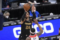 Memphis Grizzlies guard Dillon Brooks (24) shoots against Washington Wizards guard Bradley Beal (3) during the first half of an NBA basketball game, Tuesday, March 2, 2021, in Washington. (AP Photo/Nick Wass)