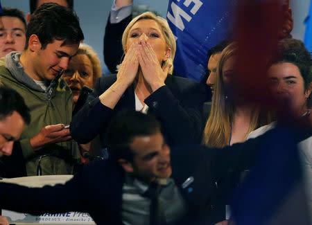 Marine Le Pen, French National Front (FN) political party leader and candidate for French 2017 presidential election, greets supporters at the end of a political rally in Bordeaux, France, April 2, 2017. REUTERS/Regis Duvignau