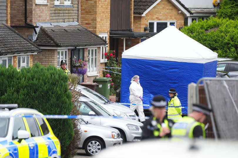 A forensic officer at the scene in Ashlyn Close
