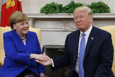 U.S. President Donald Trump meets with German Chancellor Angela Merkel in the White House Oval Office in Washington, U.S., April 27, 2018. REUTERS/Kevin Lamarque