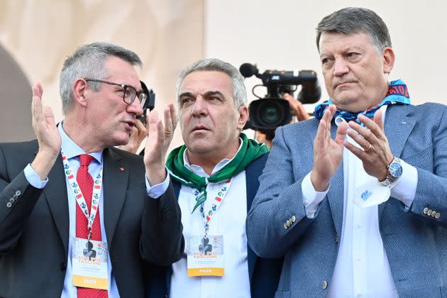 (From L) General Secretary of the Italian General Confederation of Labour (CGIL), Maurizio Landini, General Secretary of the Italian Confederation of Labour Unions (CISL), Luigi Sbarra and General Secretary of the Italian Labour Union (UIL), PierPaolo Bombardieri applaud on stage at the end of an anti-fascist rally called by Italian Labour unions CGIL, CISL and UIL at Piazza San Giovanni in Rome on October 16, 2021, a week after a demonstration against the so-called Green Pass degenerated into an assault on the CGIL trade union building, led by the neo-fascist Forza Nuova party. (Photo by Alberto PIZZOLI / AFP) (Photo by ALBERTO PIZZOLI/AFP via Getty Images) (Photo: ALBERTO PIZZOLI via Getty Images)