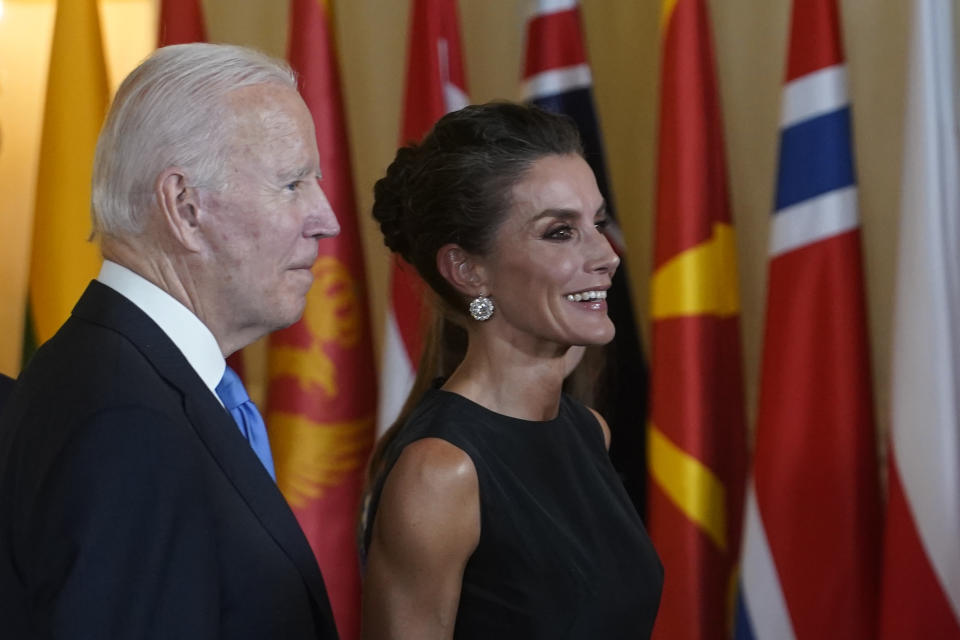 FILE - U.S. President Joe Biden walks with Spain's Queen Letizia before a gala dinner at the Royal Palace in Madrid, Spain, Tuesday, June 28, 2022. Spain’s Queen Letizia turned 50 on Thursday, Sept. 15, 2022. Spain is taking the opportunity to assess its scarred monarchy and ponder how the arrival of a middle-class commoner may help shake one of Europe’s most storied royal dynasties into a modern and more palatable institution. (AP Photo/Andrea Comas, File)