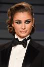 <p>The only thing bolder than wearing a tuxedo on a red carpet is pairing it with an Old Hollywood wave set and a dramatic metallic blue eye look. Somehow it all works—and it's one of our favorite looks of the night.</p>