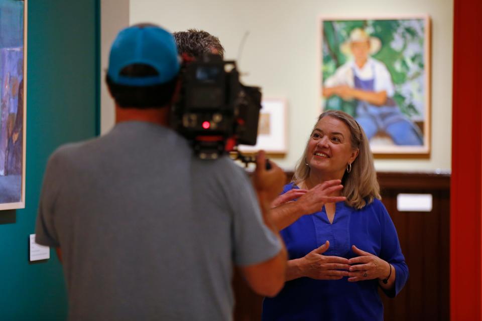 Maria Lawton films an episode of her PBS show, Maria's Portuguese Table, inside the New Bedford Whaling Museum where work by Azorean artist Domingos Rebelo was on display.