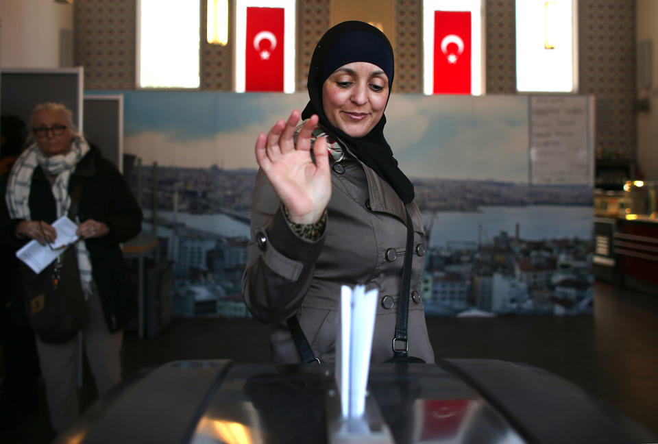 A woman votes in a mosque in the Amsterdam