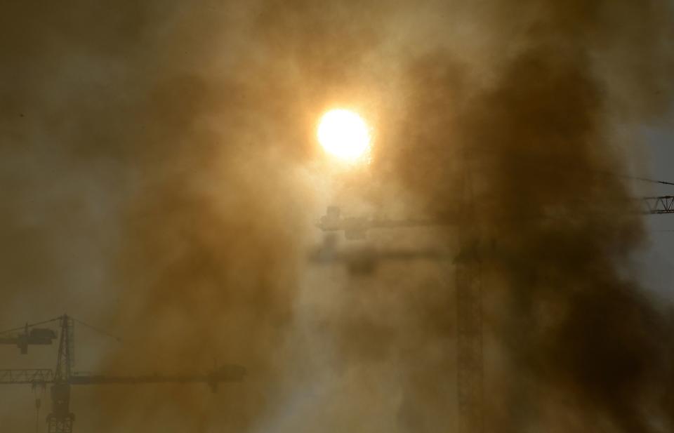 Smoke billows from a fire at a construction site in the China Basin area of San Francisco March 11 2014. (REUTERS/Josh Edelson)