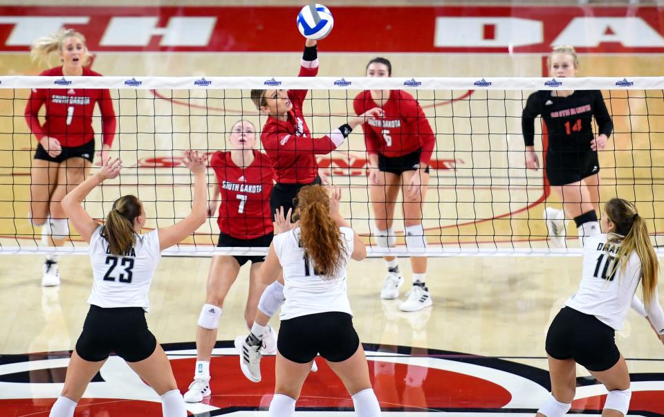 South Dakota's Madison Jurgens  hits the ball over to Omaha during the Summit League Tournament championship match on Saturday, November 27, 2021, at the Sanford Coyote Sports Center in Vermillion.