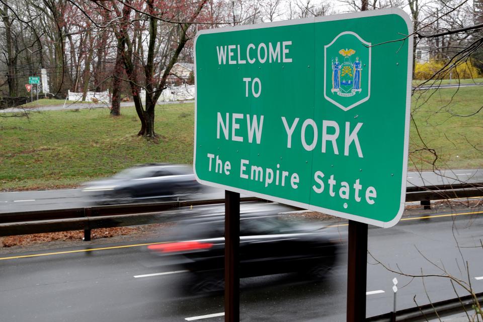 A sign welcomes motorists to New York, on the border with Connecticut, near Rye Brook, N.Y., Sunday, March 29, 2020.
