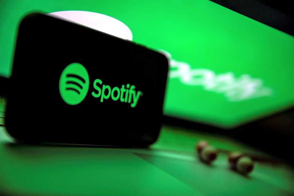 spotify logo on phone and computer