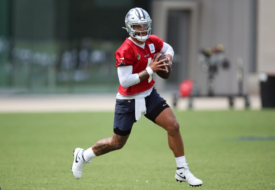 Jun 4, 2024; Frisco, TX, USA; Dallas Cowboys quarterback Dak Prescott (4) goes through a drill during practice at the Ford Center at the Star Training Facility in Frisco, Texas.