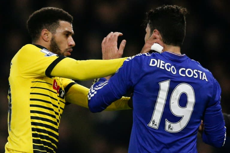 Watford's midfielder Etienne Capoue (L) confronts Chelsea's striker Diego Costa (R) after Costa bundled over Watford's Juan Carlos Paredes in an off the ball incident, during the English Premier League football match in Watford on February 3, 2016