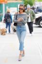 <p>In an Aritzia off-the-shoulder sweater, Levi's straight-leg jeans, gingham platform heels, Roberi & Fraud sunglasses, hoop earrings and a black leather shoulder bag while out in NYC.</p>