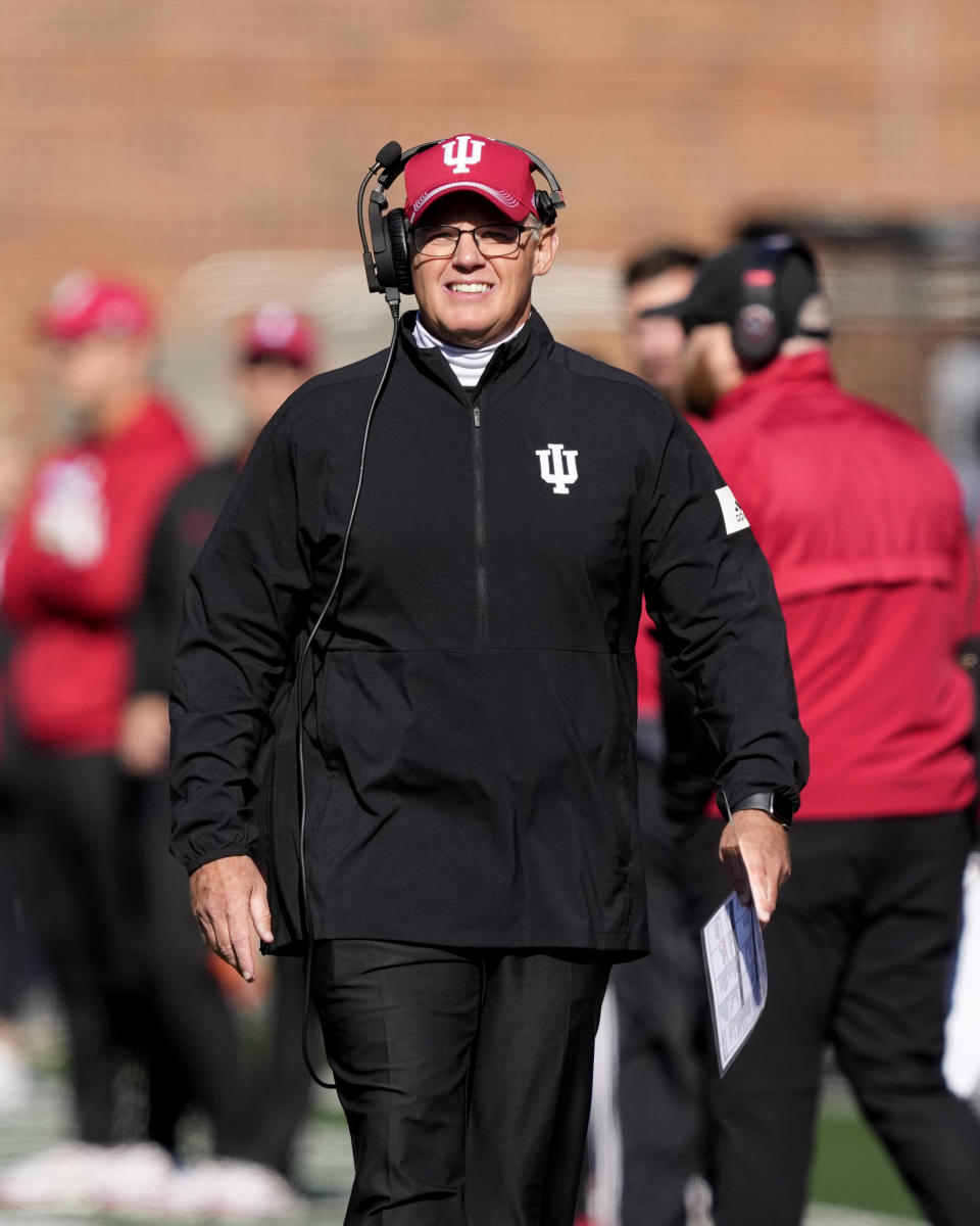 Indiana head coach Tom Allen looks at the scoreboard during the first half of an NCAA college football game against Illinois on Saturday, Nov. 11, 2023, in Champaign, Ill. (AP Photo/Charles Rex Arbogast)