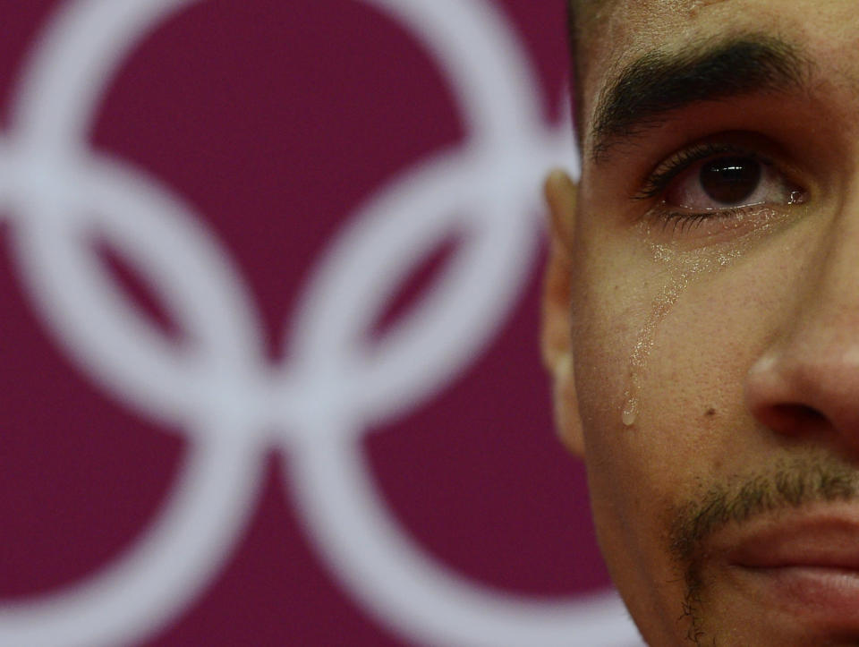 Louis Smith of Great Britain cries during the men's gymnastics qualification in the North Greenwich Arena during the London 2012 Olympic Games July 28, 2012. REUTERS/Dylan Martinez (BRITAIN - Tags: SPORT GYMNASTICS OLYMPICS) 