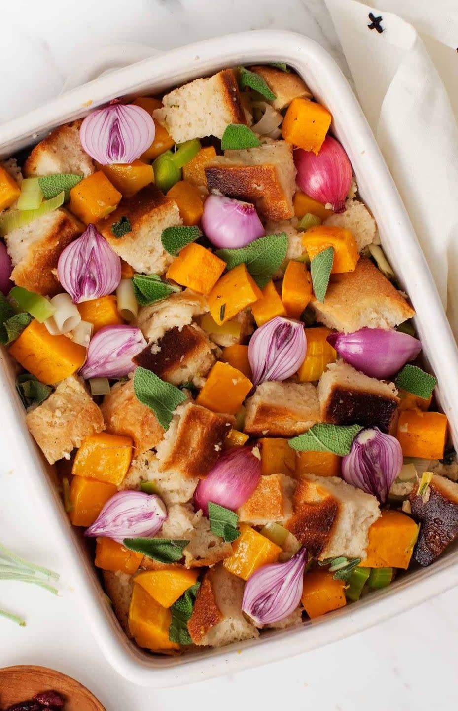 <p>This healthier stuffing recipe has loads of seasonal veggies and flavors, including butternut squash, pearl onions, sage, and rosemary.</p><p>Get the <strong><a href="https://www.loveandlemons.com/butternut-squash-casserole/" rel="nofollow noopener" target="_blank" data-ylk="slk:Butternut Squash Casserole recipe;elm:context_link;itc:0;sec:content-canvas" class="link ">Butternut Squash Casserole recipe</a></strong> at Love & Lemons. </p>