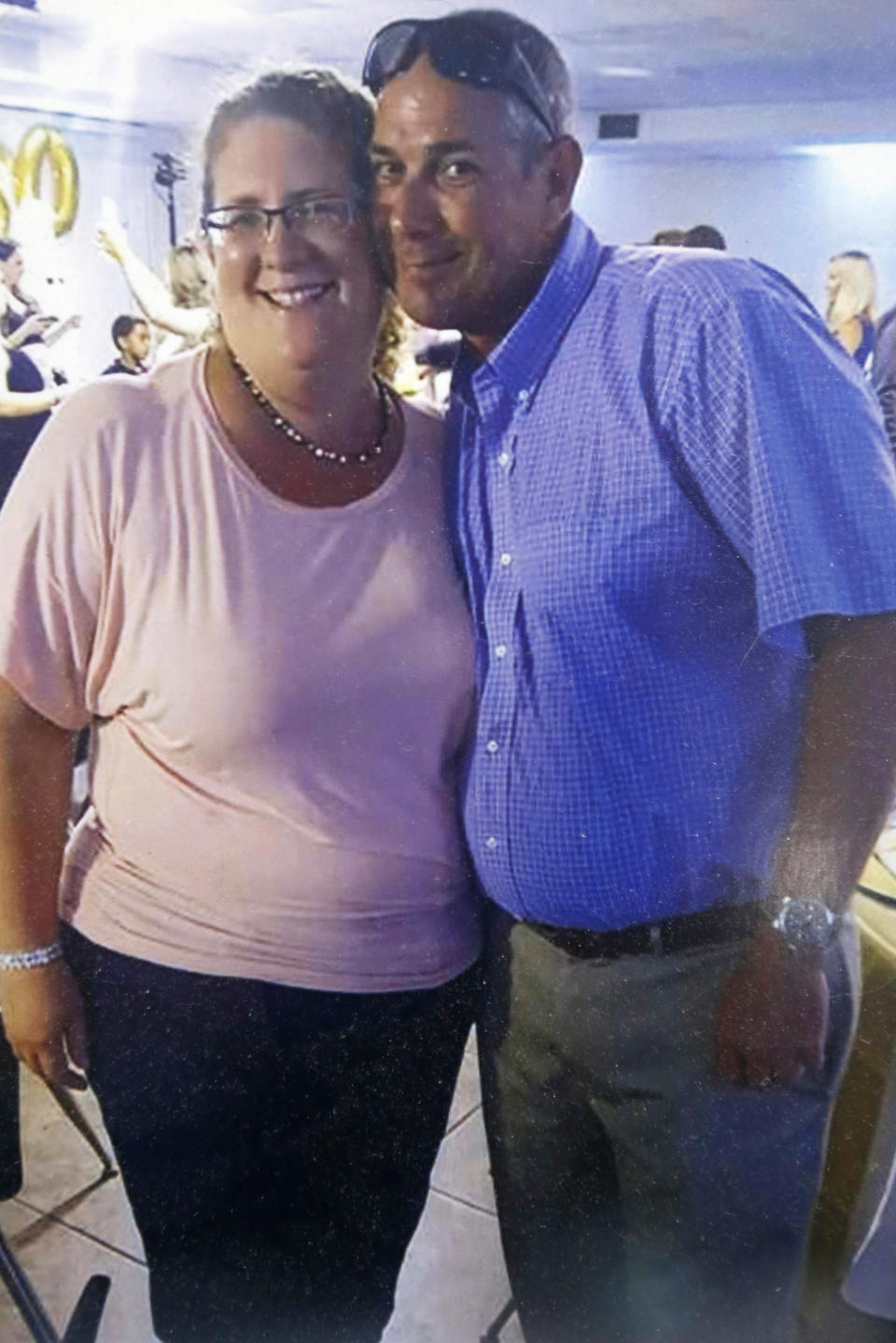 This undated image provided by Jason Nixon, shows a photo of Jason and his wife Kate Nixon, prior to last years shooting that took the life of Kate Nixon in Virginia Beach, Va. As the shooting's one-year anniversary approaches, some of the victim's family members say the rampage is effectively forgotten. “We were a flash in the pan,” Nixon said. “I think that we should have had a lot more attention. It’s not normal for someone to wake up and go murder 12 people.” (Jason Nixon via AP)
