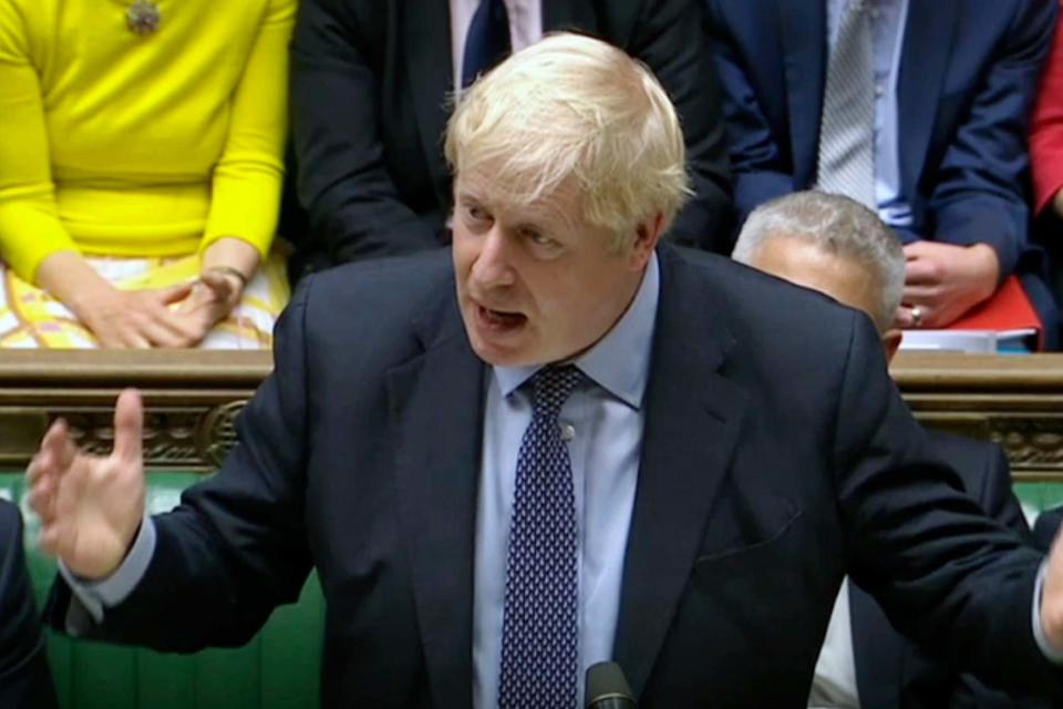 Boris Johnson speaks inside the House of Commons (AP)