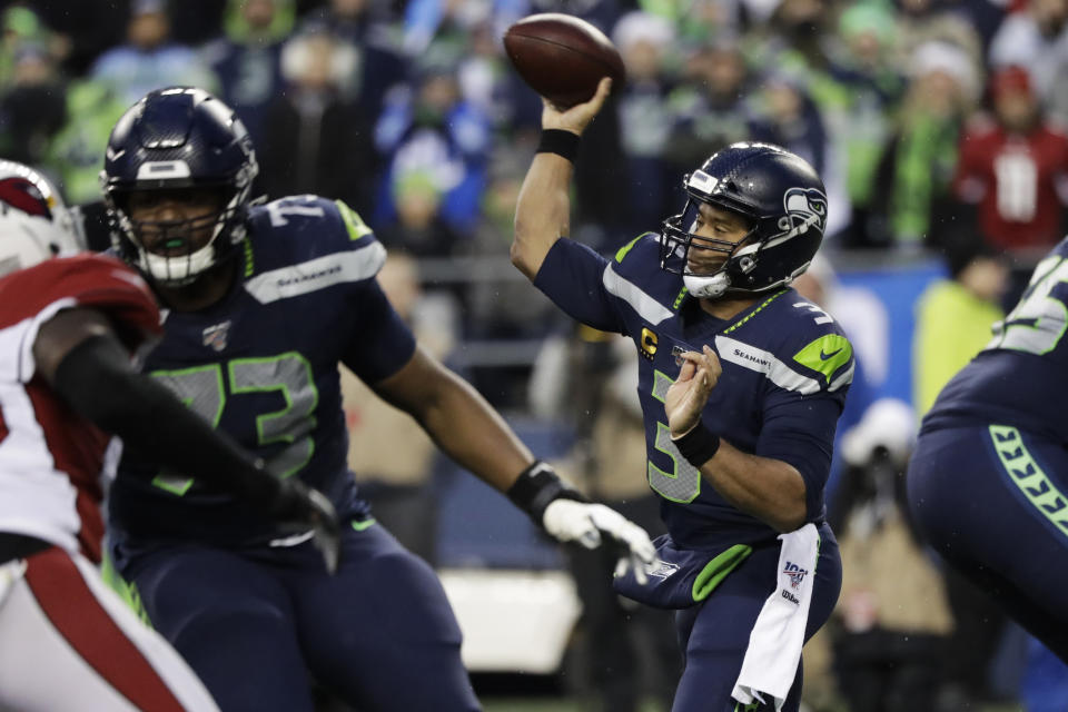 Seattle Seahawks quarterback Russell Wilson (3) passes against the Arizona Cardinals during the second half of an NFL football game, Sunday, Dec. 22, 2019, in Seattle. (AP Photo/Elaine Thompson)