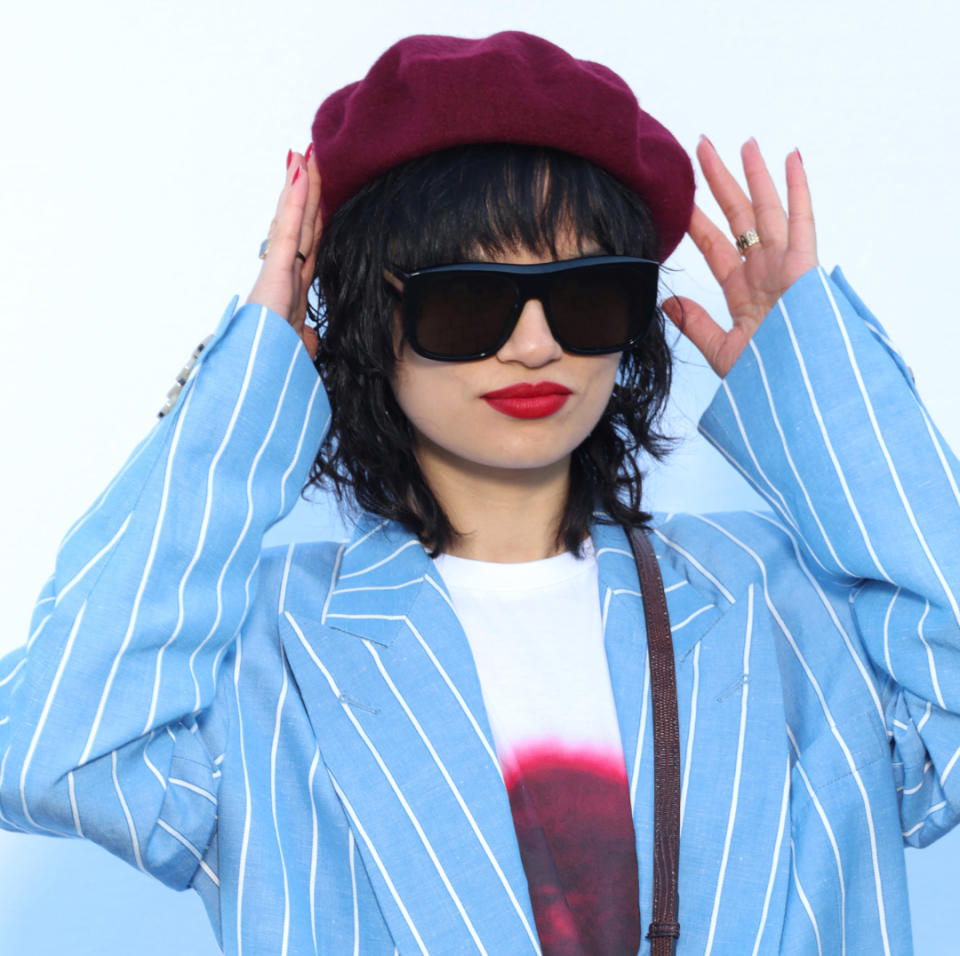 woman with black hair and blunt bangs