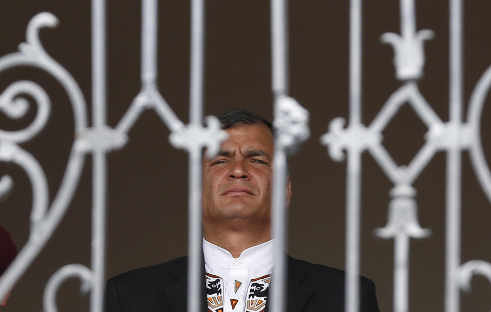 FILE - In this Nov. 10, 2014 file photo, Ecuador's President Rafael Correa waits for the start of a head of state visit at the entrance of the government palace in Quito, Ecuador. For the first time in a decade, Correa won't be running when Ecuadoreans head to the polls on Sunday, Feb. 19, 2017, to elect his successor. (AP Photo/Dolores Ochoa, File)