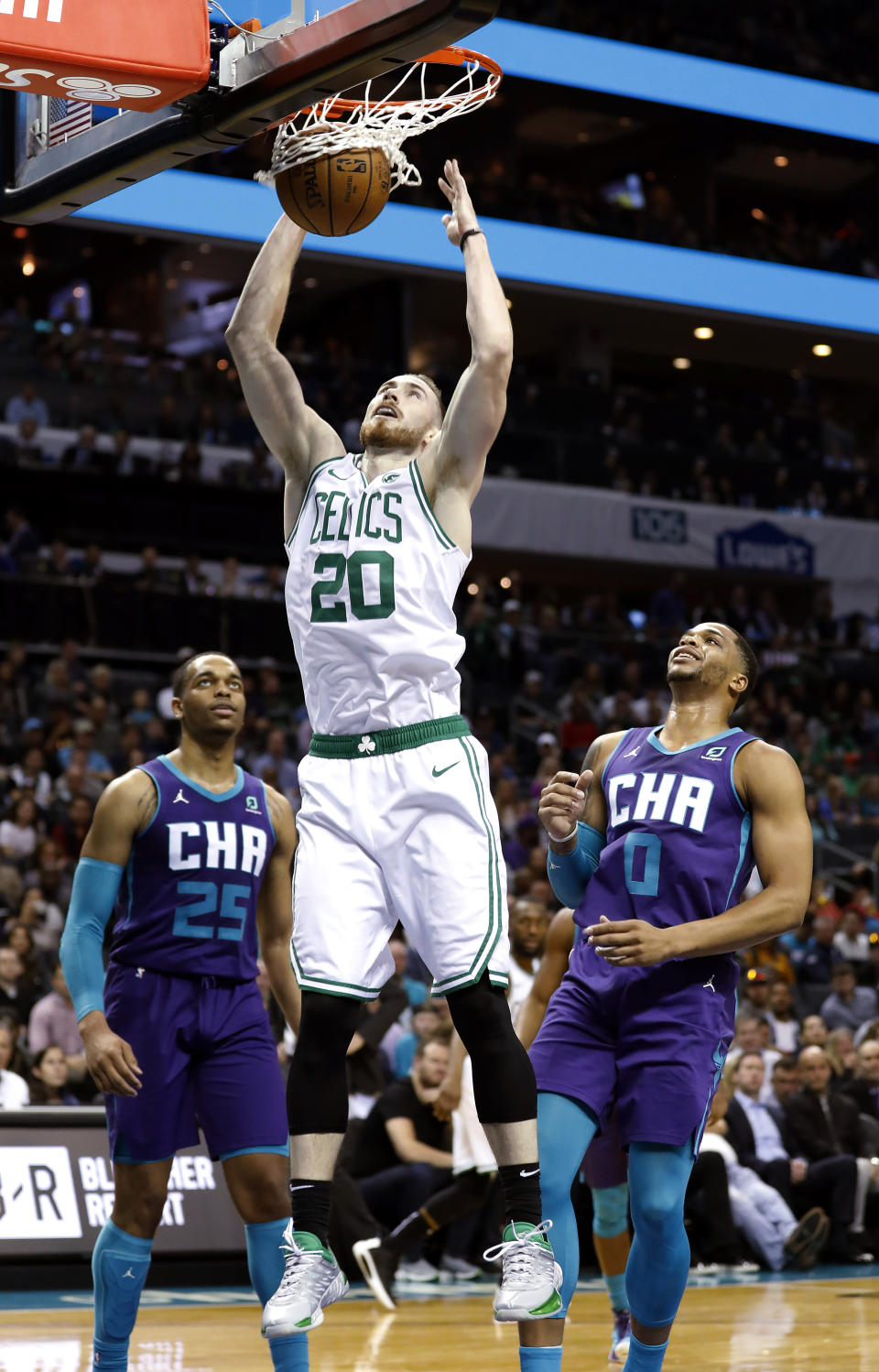 Boston Celtics' Gordon Hayward (20) dunks as Charlotte Hornets' P.J. Washington (25) and Miles Bridges (0) watch during the first half of an NBA basketball game in Charlotte, N.C., Thursday, Nov. 7, 2019. (AP Photo/Bob Leverone)