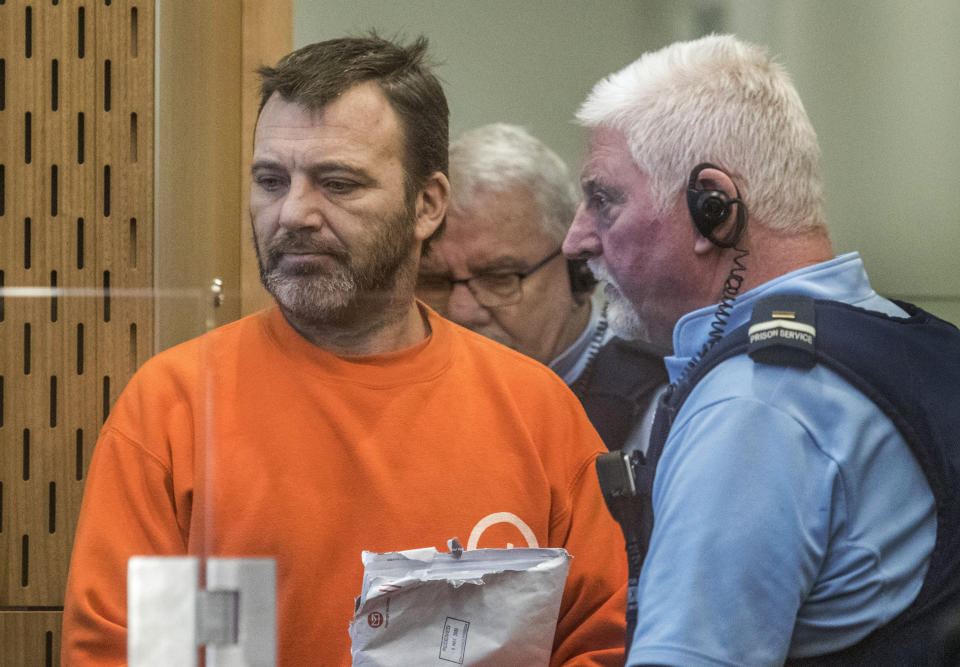 Philip Neville Arps, left, appears for sentencing in the Christchurch District Court, in Christchurch, New Zealand, Tuesday, June 18, 2019. The Christchurch businessman who shared a video of worshippers being slaughtered at a New Zealand mosque has been sentenced to 21 months in prison. (John Kirk-Anderson/Pool via AP)