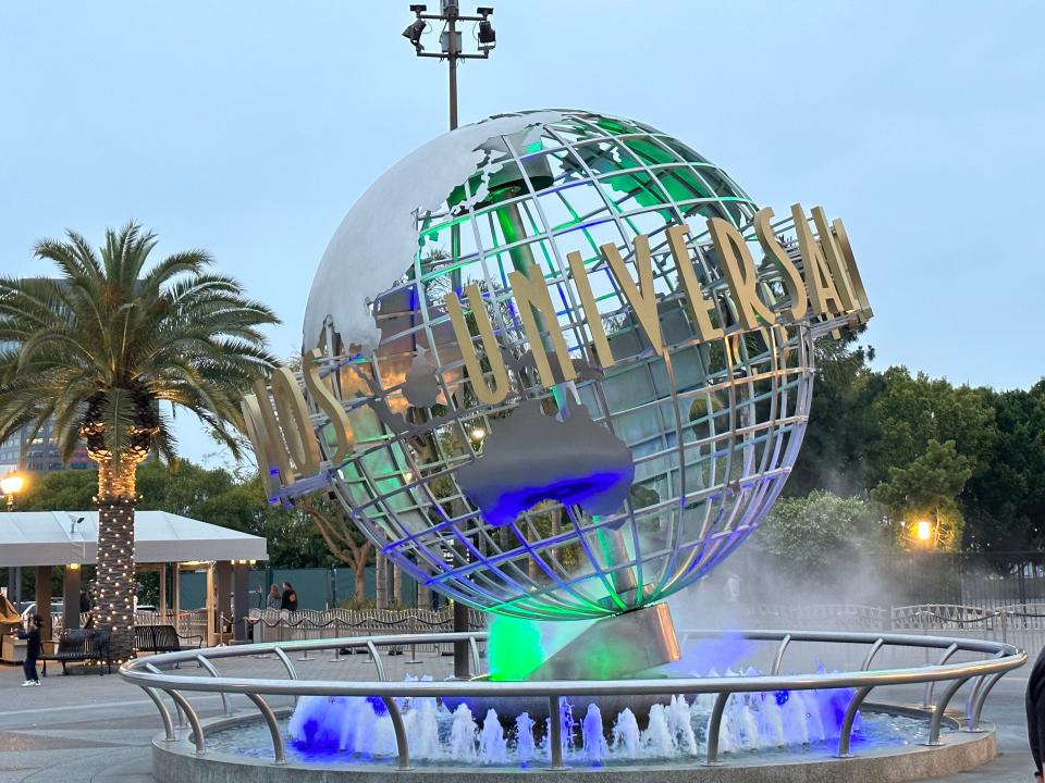 universal studios globe lit up blue and green