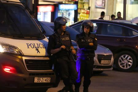 Policemen are seen near the Israeli embassy in Amman, Jordan July 23, 2017. REUTERS/ Stringer