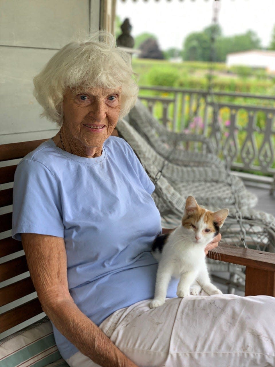 Grace Sidell-Nause sits on her porch with her cat. Fremont Mayor Danny Sanchez has designated July 20, 2023, as “Ms. Grace Day” in honor of Sidell-Nause, who died Dec. 12.