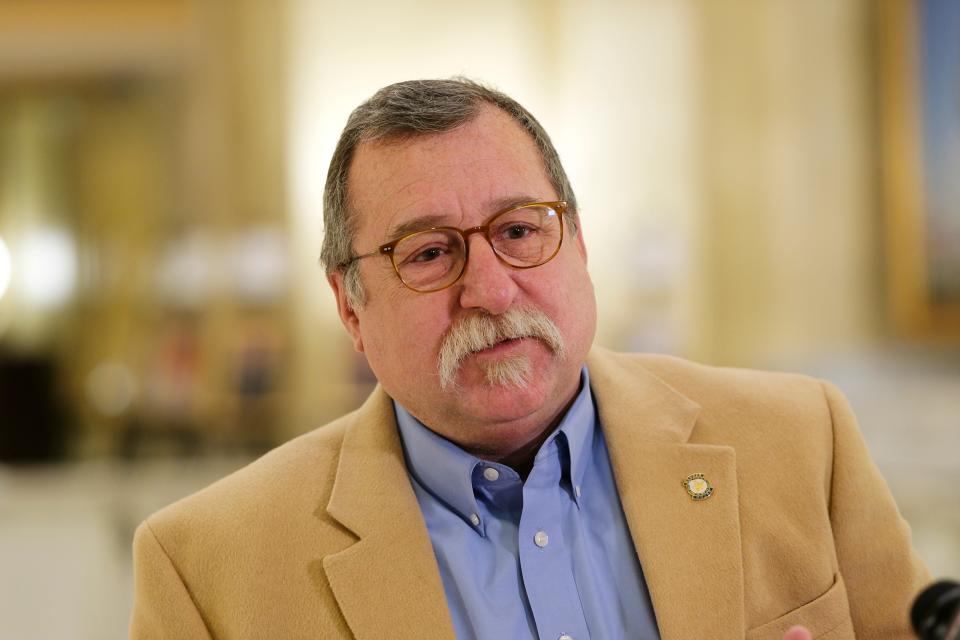 Committee Chair Rep. Mark McBride speaks with media Jan. 24 after a committee meeting.