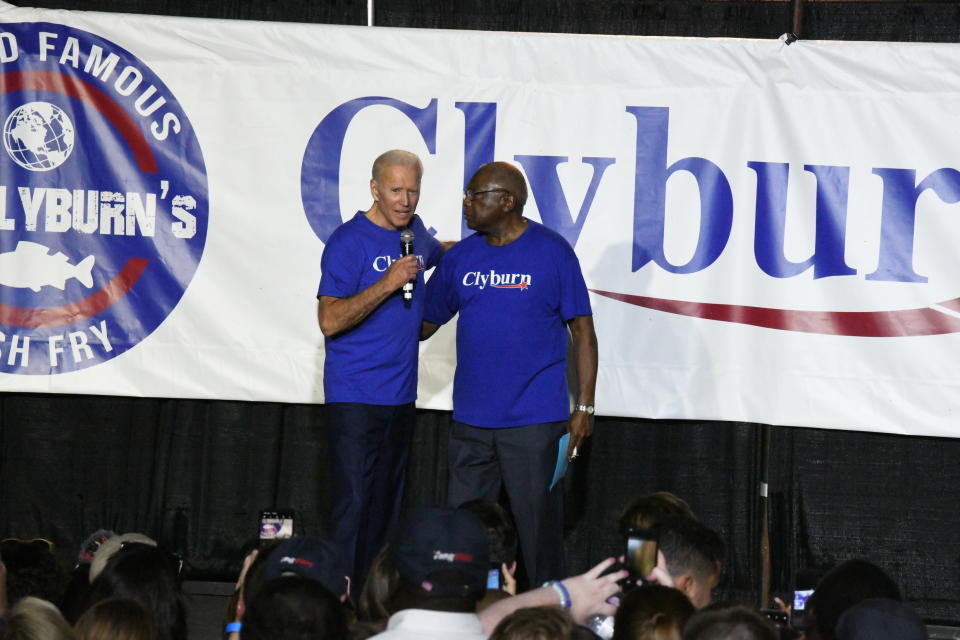 Former Vice President Joe Biden, left, greets House Majority Whip Jim Clyburn at the "World Famous Fish Fry" on Friday, June 21, 2019, in Columbia, S.C. (AP Photo/Meg Kinnard)