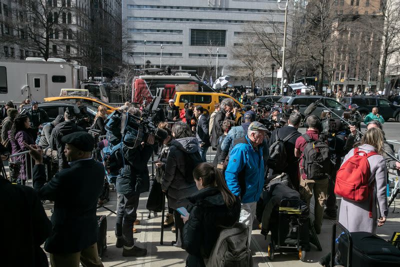 A group of media wait outside New York Criminal Court following film producer Harvey Weinstein's guilty verdict in his sexual assault trial in New York