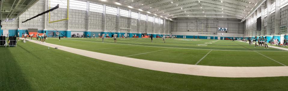 Panoramic look at the Dolphins stretching as training camp opens for 2024.